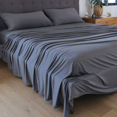 Graphite sheet set shown on bed in bedroom environment. #choose-your-color_graphite