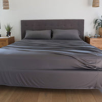 Graphite sheet set shown on bed in bedroom environment. #choose-your-color_graphite