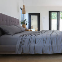 Graphite sheet set shown on bed in bedroom environment. #choose-your-color_graphite