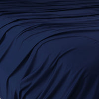 Navy Blue sheet set shown on bed in bedroom environment. #choose-your-color_navy