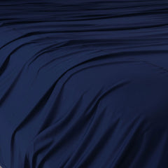 Navy Blue sheet set shown on bed in bedroom environment. #choose-your-color_navy