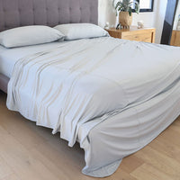 Pearl Blue sheet set shown on bed in bedroom environment. #choose-your-color_pearl-blue