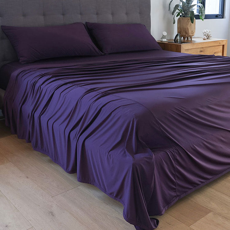 Royal Plum sheet set shown on bed in bedroom environment. #choose-your-color_royal-plum