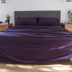 Royal Plum sheet set shown on bed in bedroom environment. #choose-your-color_royal-plum