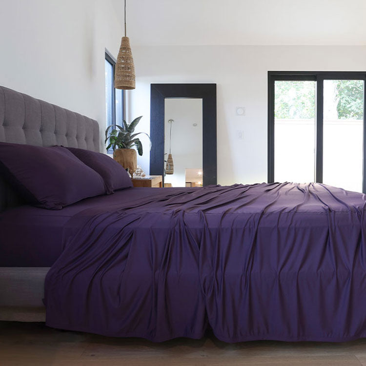 Royal Plum sheet set shown on bed in bedroom environment. #choose-your-color_royal-plum