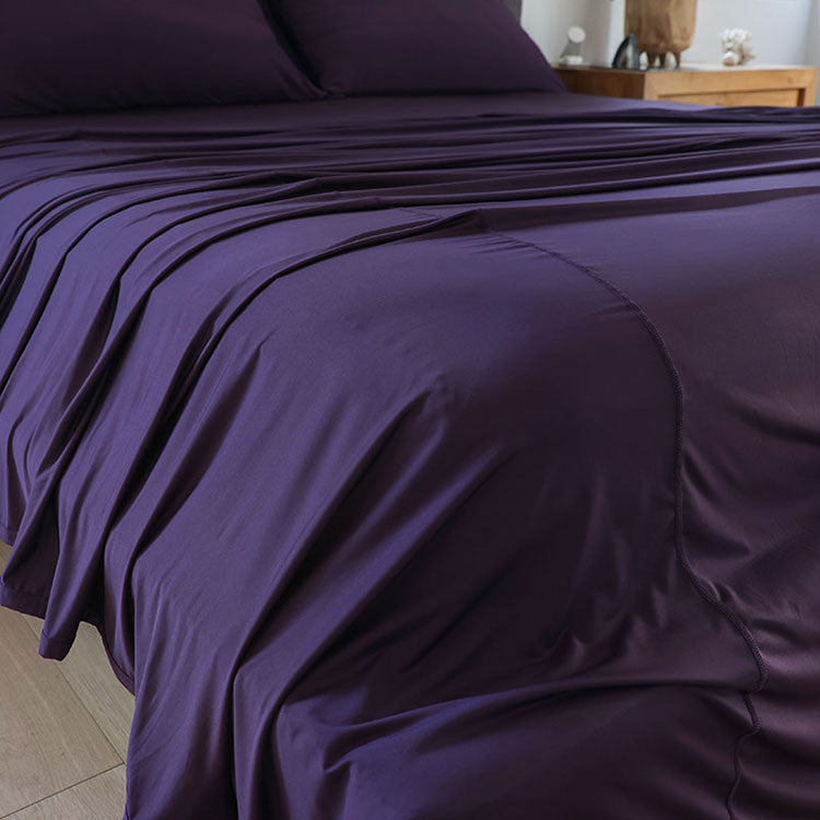 Royal Plum sheet set shown on bed in bedroom environment. #choose-your-color_royal-plum