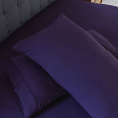 Royal Plum sheet set shown on bed in bedroom environment. #choose-your-color_royal-plum