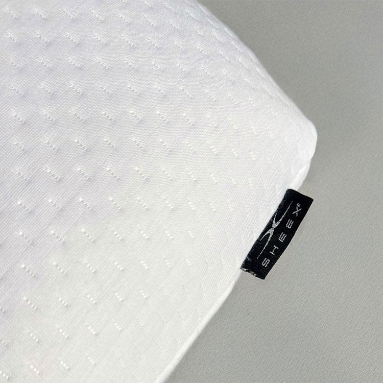 SleepScent Pillows close up detail photo showing the SHEEX tag and tight stitch quality of the pillow