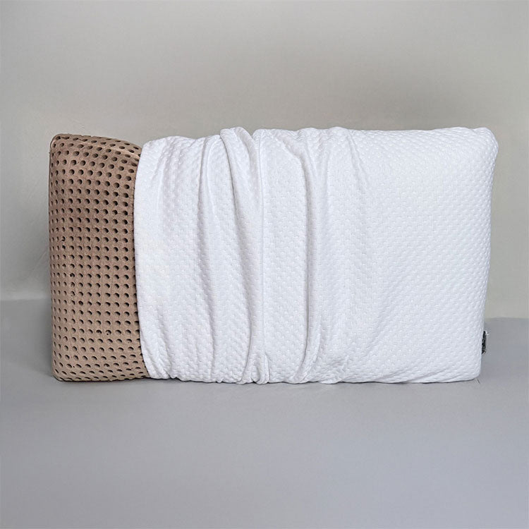 SleepScent Pillow featured in Contour version with cover pulled back showing the breathable foam which has holes allowing air flow.