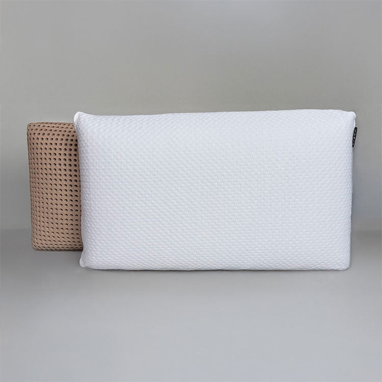 SleepScent Pillow featured in Contour version with cover pulled back showing the breathable foam which has holes allowing air flow.