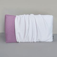 SleepScent Pillows featured in Regular version with pillow cover pulled away to reveal purple foam insert with holes for breathability and airflow.