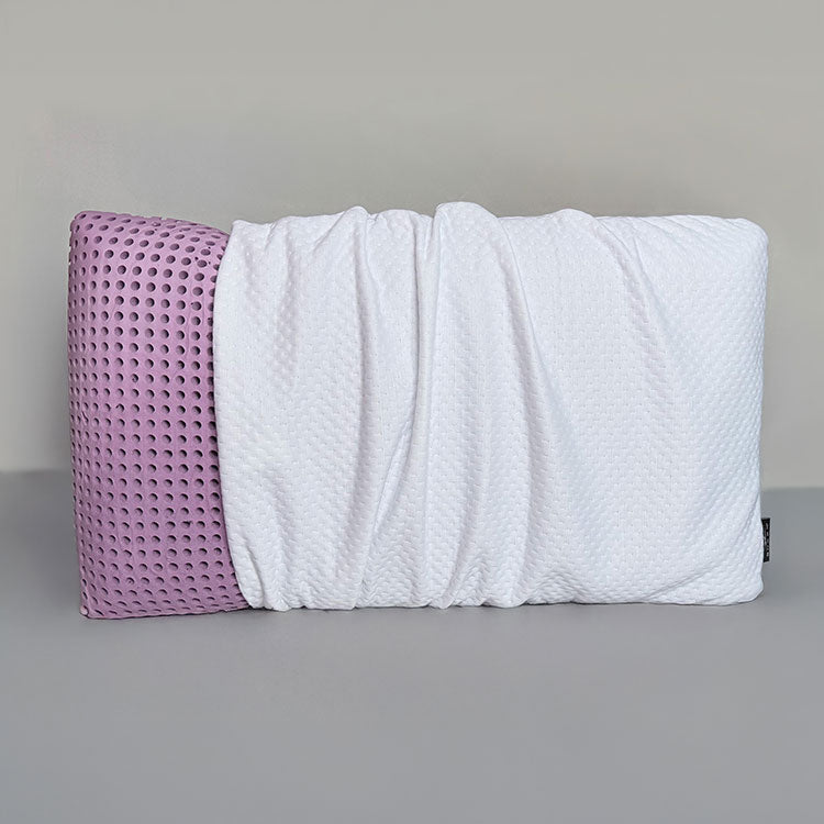 SleepScent Pillows featured in Regular version with pillow cover pulled away to reveal purple foam insert with holes for breathability and airflow.