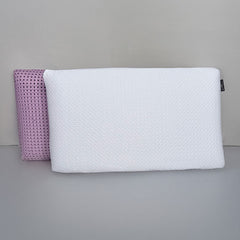 SleepScent Pillows featured in Regular version with pillow cover pulled away to reveal purple foam insert with holes for breathability and airflow.