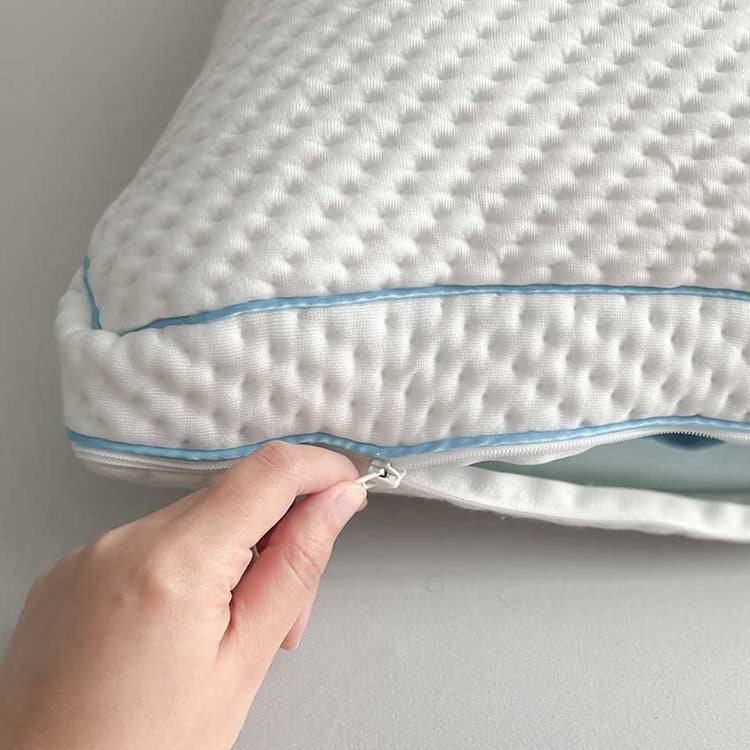 SHEEX Versa Cloud Pillow being zipped closed with blue cooling foam showing and down alternative fiber fill on top the foam - on grey background.