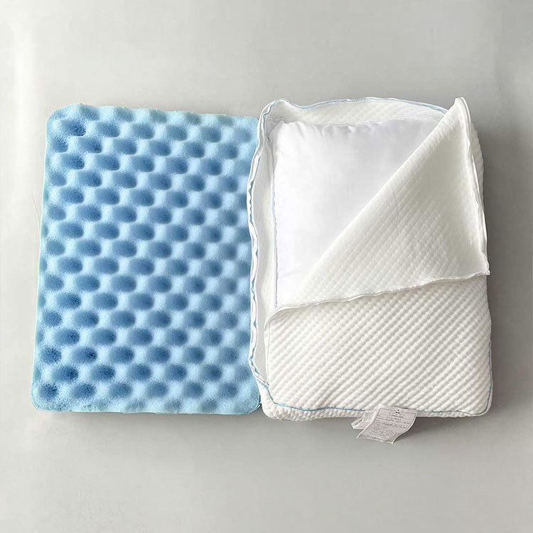 SHEEX Versa Cloud Pillow unzipped with blue cooling foam showing and down alternative fiber fill behind the foam - on grey background. 