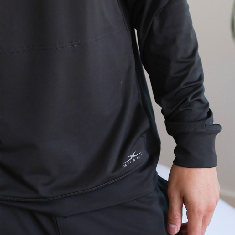 Model wearing black SHEEX Men's Hoodie #choose-your-color_black