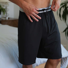Model wearing SHEEX Men's Lounge Short in Black #choose-your-color_black