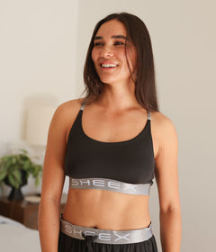 Model wearing the SHEEX Women's Bra Top in Black #choose-your-color_black