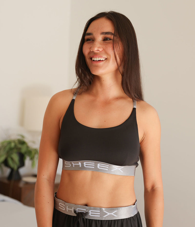 Model wearing the SHEEX Women's Bra Top in Black #choose-your-color_black