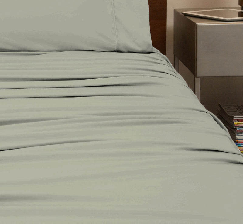 reNEWed Sheet Set on bed in room environment, Sage Mist #choose-your-color_sage-mist
