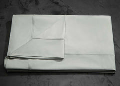 MIDNIGHT LABEL Flat Sheet shown in mist gray, folded #choose-your-color_mist-gray