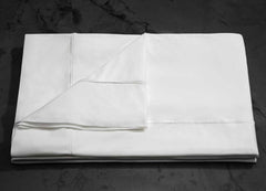 MIDNIGHT LABEL Flat Sheet shown in porcelain folded #choose-your-color_porcelain