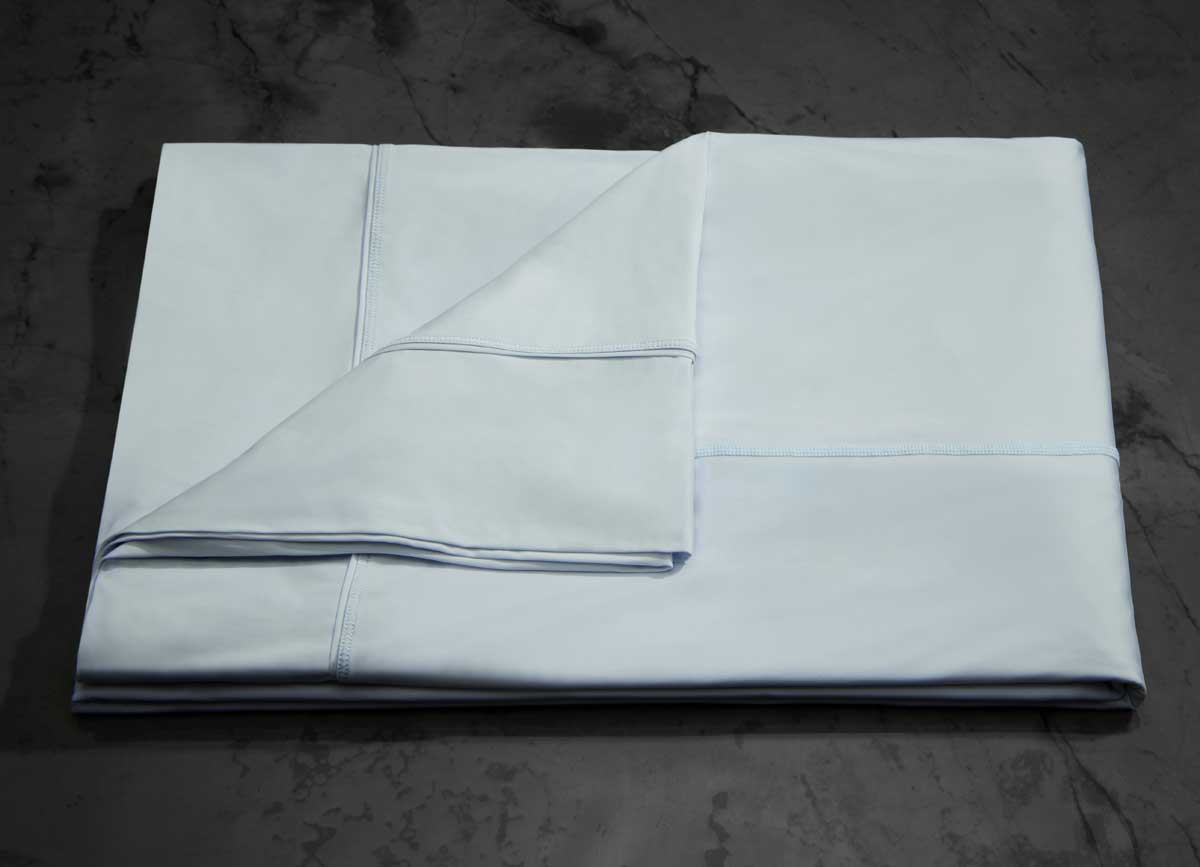  MIDNIGHT LABEL Flat Sheet shown in spa blue, folded #choose-your-color_spa-blue