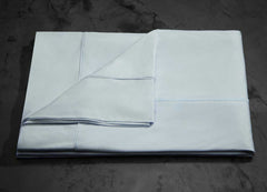  MIDNIGHT LABEL Flat Sheet shown in spa blue, folded #choose-your-color_spa-blue