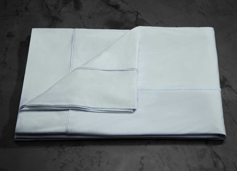  MIDNIGHT LABEL Flat Sheet shown in spa blue, folded #choose-your-color_spa-blue