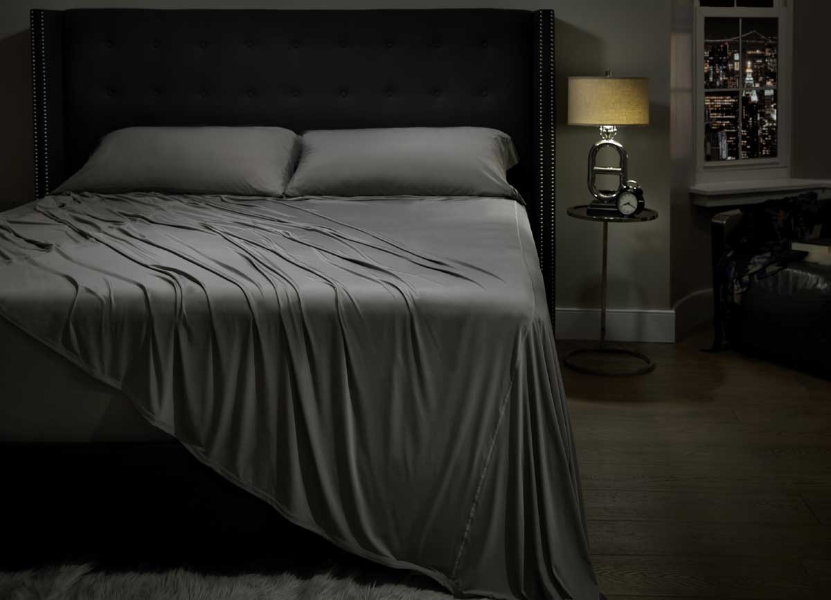 Lifestyle image of MIDNIGHT LABEL Flat Sheet shown in stone  #choose-your-color_stone