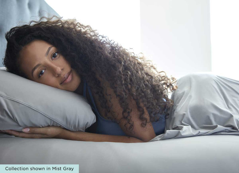 midnight label pillowcase - lifestyle of model in bed #choose-your-color_stone