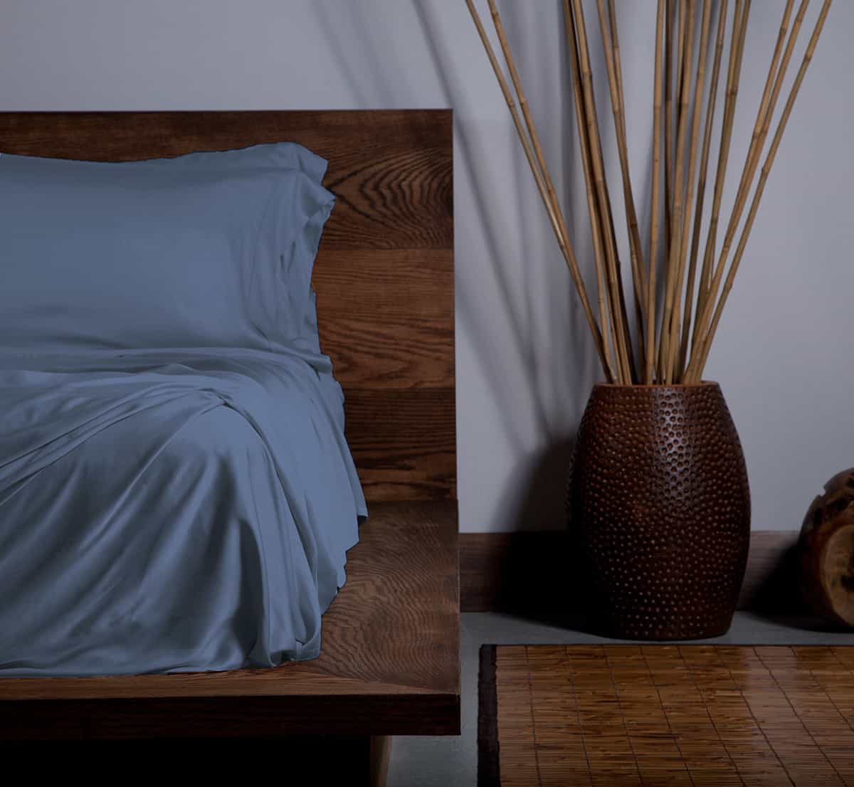 EcoSHEEX Sheet Set on Bed in Room #choose-your-color_blue_jean