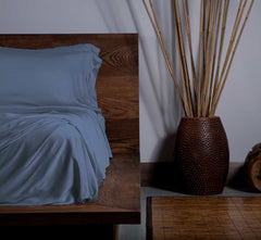 EcoSHEEX Sheet Set on Bed in Room #choose-your-color_blue_jean