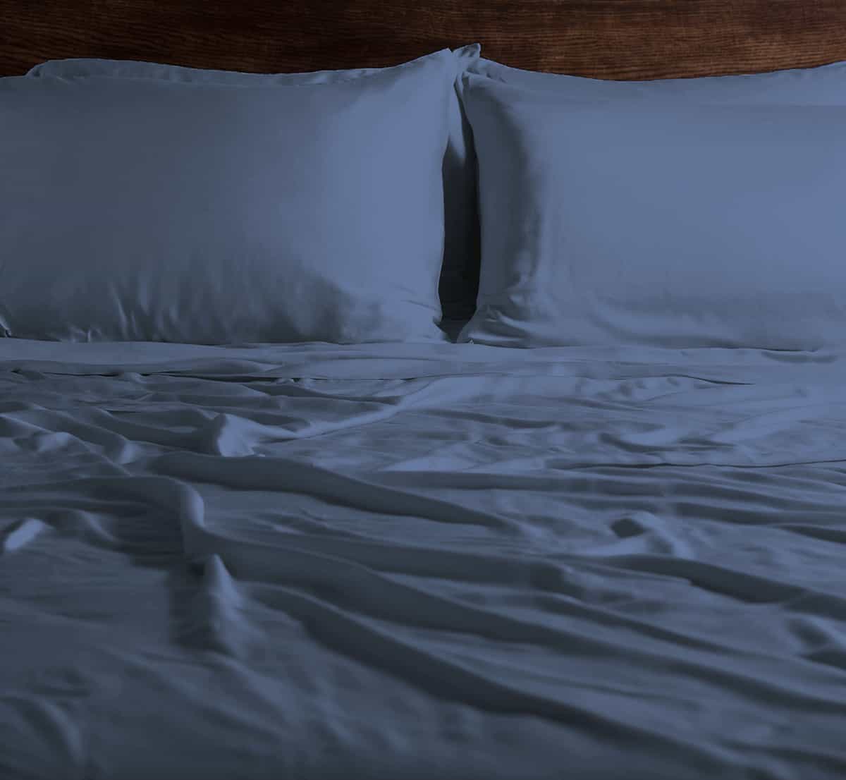 EcoSHEEX Sheet Set on Bed in Room #choose-your-color_blue_jean