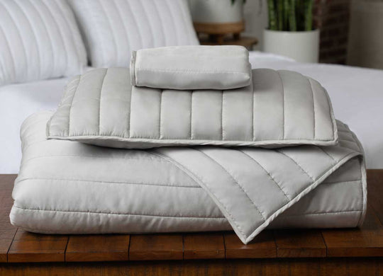 Arctic Coverlet Stack with Bed in Background #choose-your-color_silver