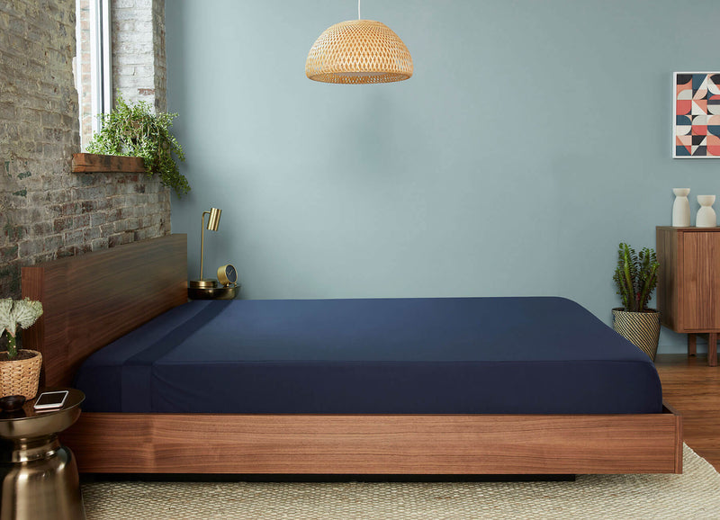 Original Performance Flat Sheet in Navy on bed #choose-your-color_navy