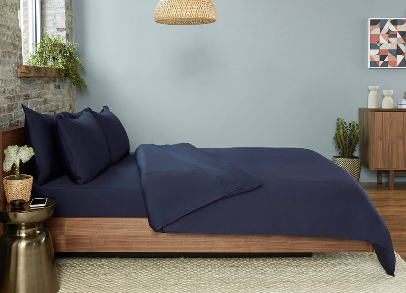 Original Performance Sheet Set in Navy on bed #choose-your-color_navy