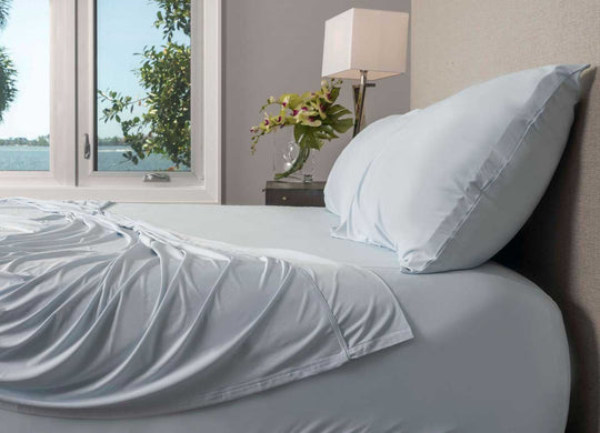 Active Comfort Pillowcases shown in Blue Frost on bed #choose-your-color_blue-frost