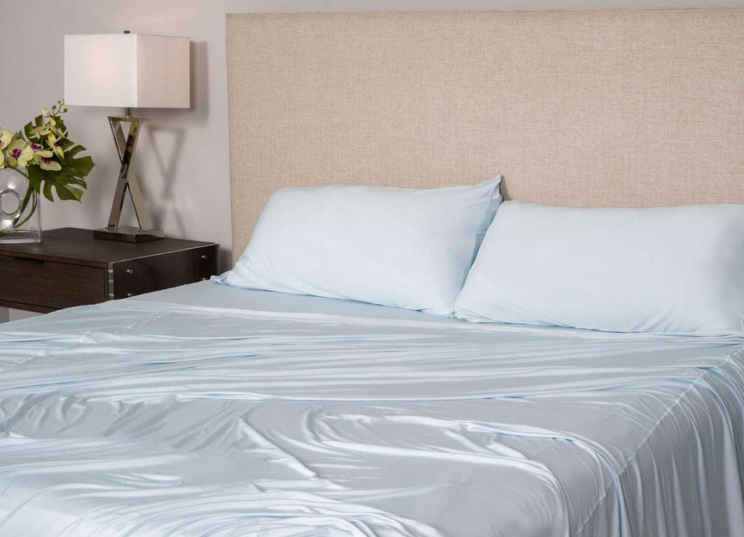 Active Comfort Pillowcases shown in Blue Frost on bed #choose-your-color_blue-frost