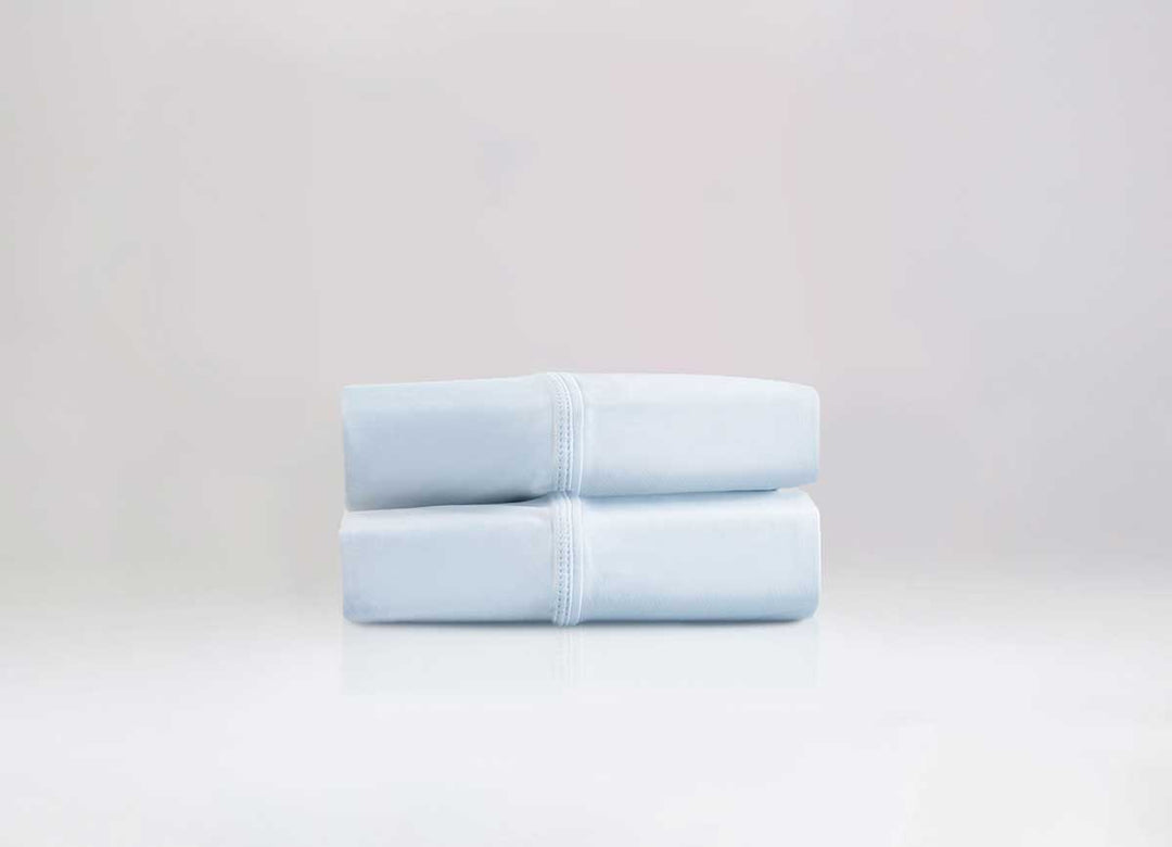 Active Comfort Pillowcases shown in Blue Frost in stack #choose-your-color_blue-frost