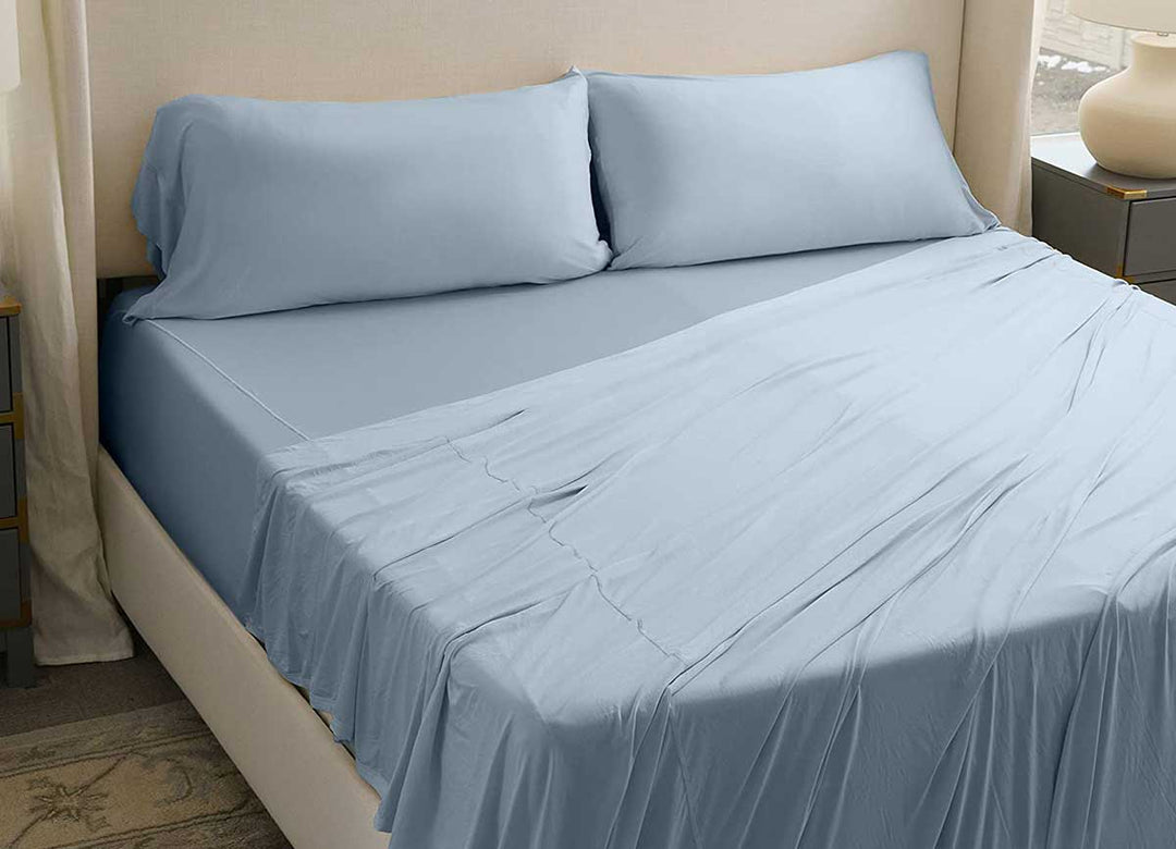 Active Comfort Pillowcases shown on bed in Blue Sky #choose-your-color_blue-sky