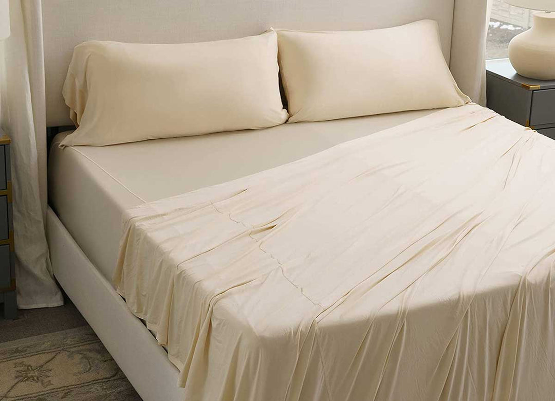 Active Comfort shown on bed in Cream #choose-your-color_cream
