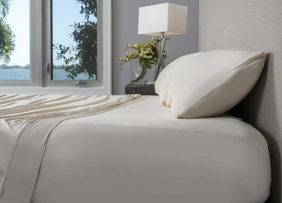 Active Comfort shown on bed in Parchment #choose-your-color_parchment
