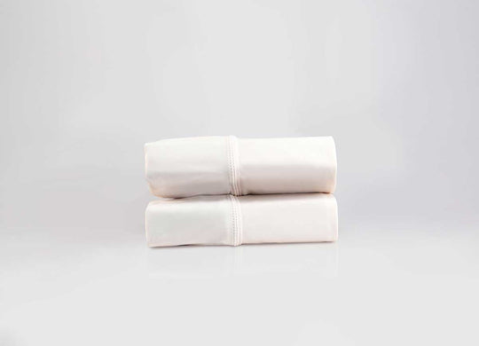 Active Comfort Pillowscases shown in Parchment in stack #choose-your-color_parchment
