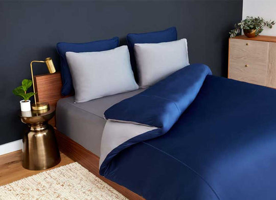 Studio Tech Bedding in navy and graphite in room environment #choose-your-color_navy-graphite