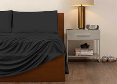 reNEWed Sheet Set on bed in room environment, black #choose-your-color_black