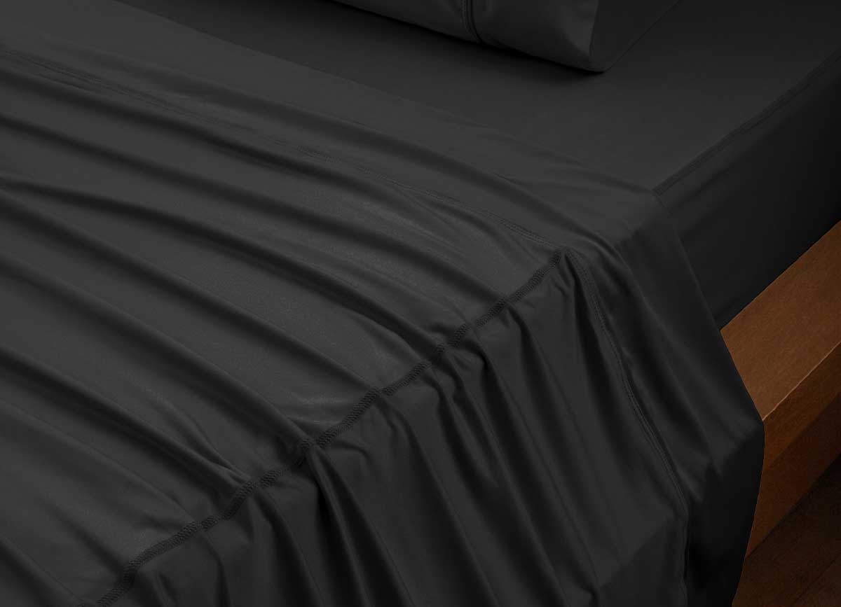 reNEWed Sheet Set on bed in room environment, black #choose-your-color_black