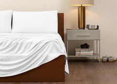 reNEWed Sheet Set on bed in room environment, Bright White #choose-your-color_bright-white