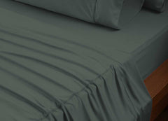 reNEWed Sheet Set on bed in room environment, forest #choose-your-color_forest