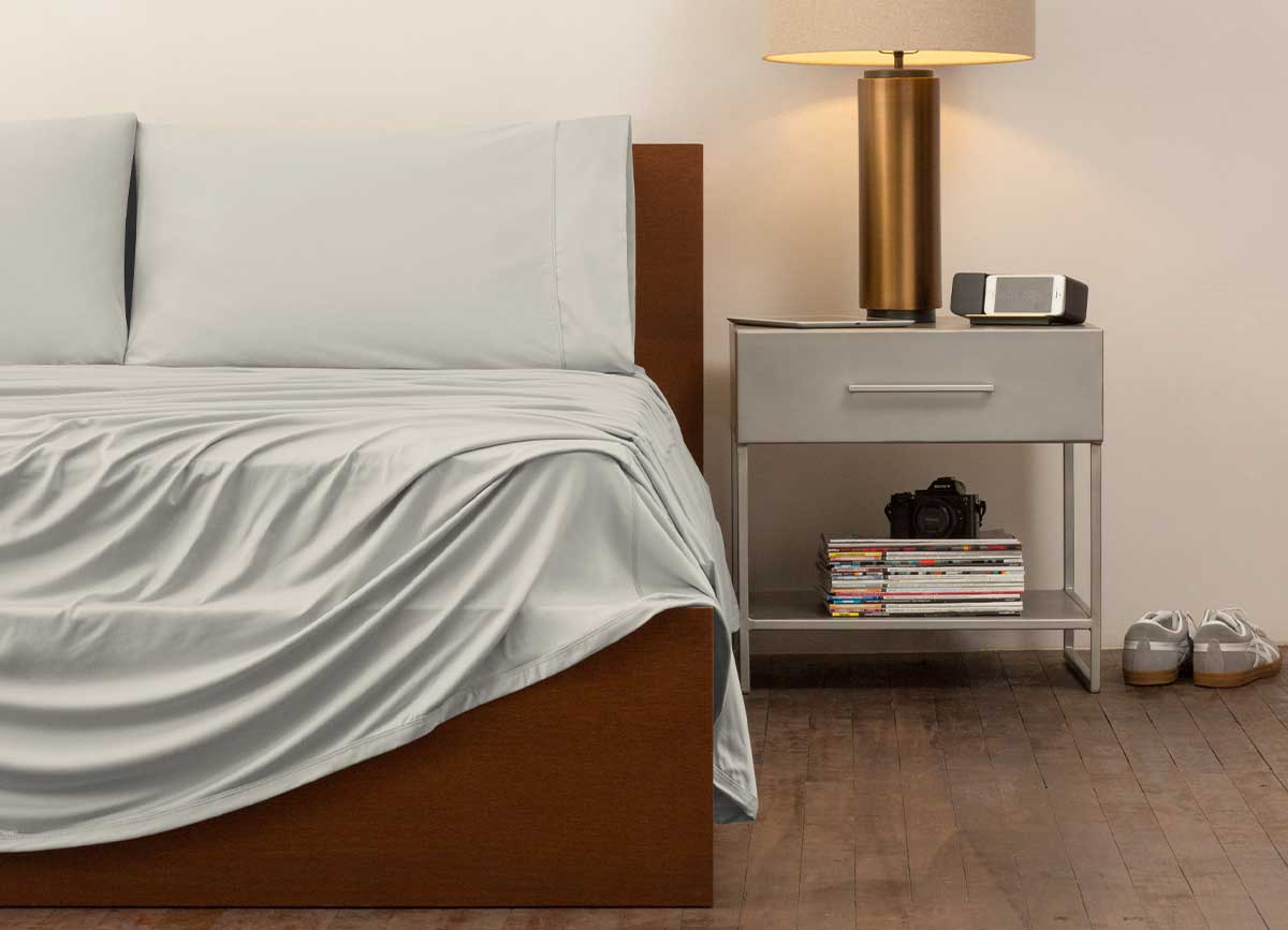 reNEWed Sheet Set on bed in room environment, Khaki #choose-your-color_khaki